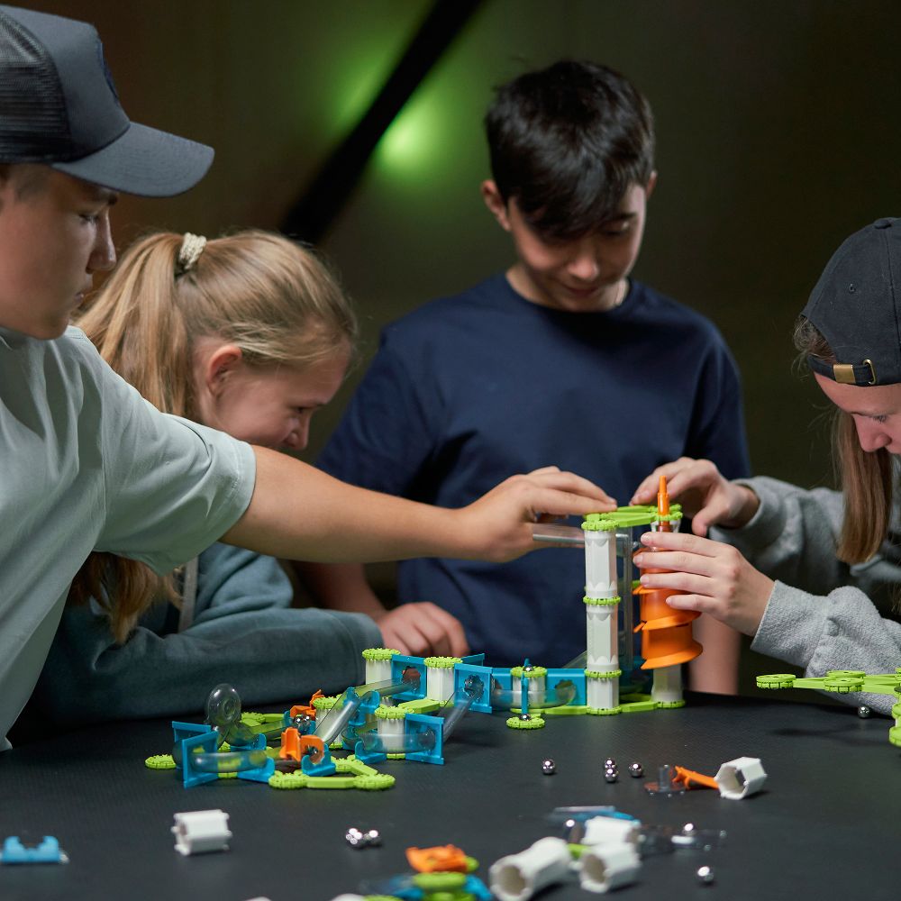 Children playing with Mechanics Gravity Elevator Circuit